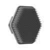 A black silicone facial cleaning brush with numerous fine bristles.