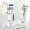 A white portable mesh nebulizer device and accessories are shown on a light gray surface.