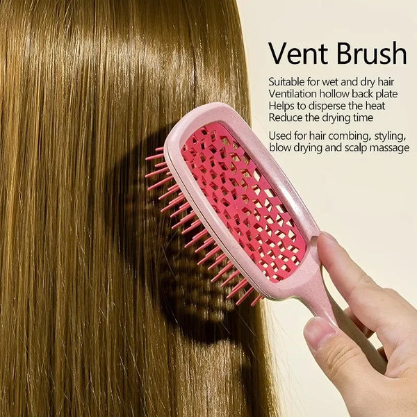 A pink vent brush is shown being used on long brown hair for combing, styling, and scalp massage.