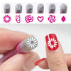 Un set de rotuladores para arte de uñas DIY con diversos diseños florales y de mariposas en fondo rosa y gris.