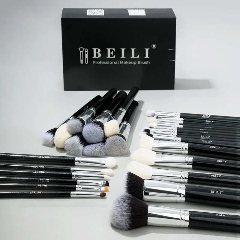 A set of 30 professional makeup brushes with black handles and white/grey bristles displayed in front of a black box.
