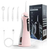 A pink portable electric oral irrigator device shown with various tips and accessories on a white background.