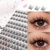 Close-up of natural black eyelash extensions applied to an eye, showing the texture and volume.