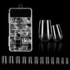 A collection of frosted French false nails with a natural finish displayed in a clear plastic container.