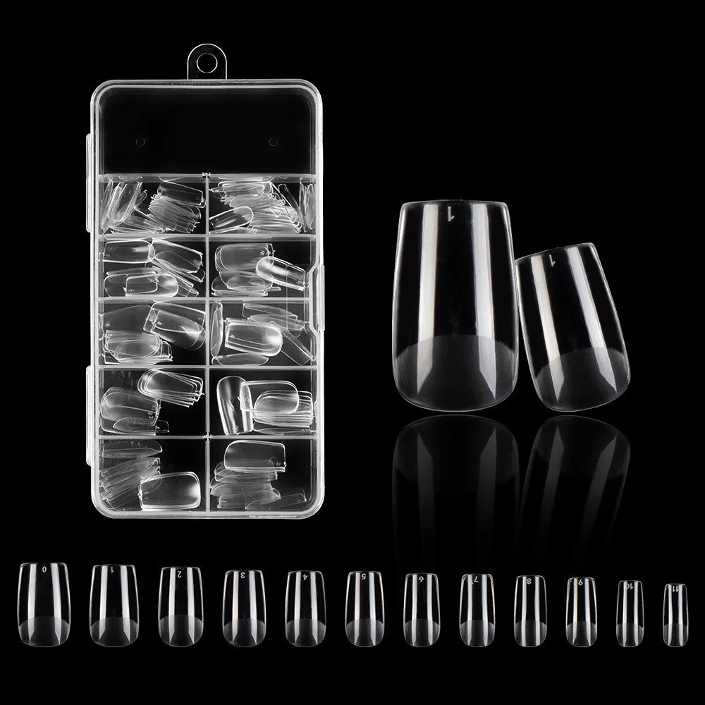 A collection of frosted French false nails with a natural finish displayed in a clear plastic container.