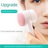 A woman is using a white facial brush with a pink silicone head for cleansing and massage on her face.