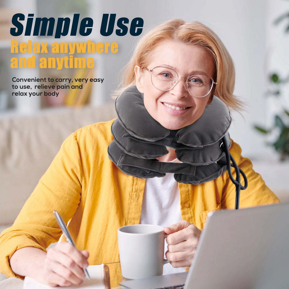 An elderly woman is using an inflatable cervical neck traction pillow for pain relief while working on a laptop.
