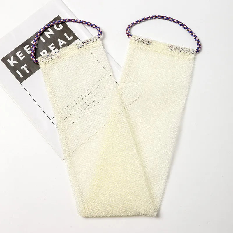 A pair of light yellow exfoliating body scrub sponges with purple string handles are displayed on a white background.