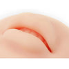A close-up view of a reusable silicone practice skin for tattoo art, showing a smooth, pinkish-tan skin texture.