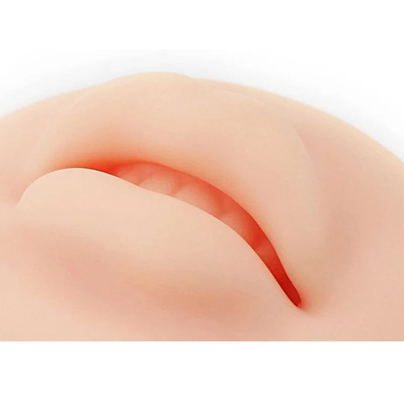 A close-up view of a reusable silicone practice skin for tattoo art, showing a smooth, pinkish-tan skin texture.