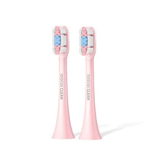 Une paire de têtes de brosse de remplacement roses et précises pour brosses à dents soniques avec des poils en forme d'étoile