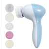 A light blue electric facial cleansing brush with various brush heads and a pink cosmetic product shown next to it.