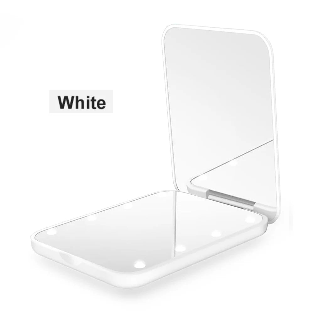 A white portable LED magnifying makeup mirror shown open and closed.