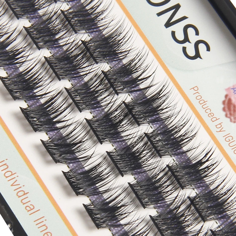 Close-up of natural wispy eyelash extensions displayed on a cosmetic product packaging.