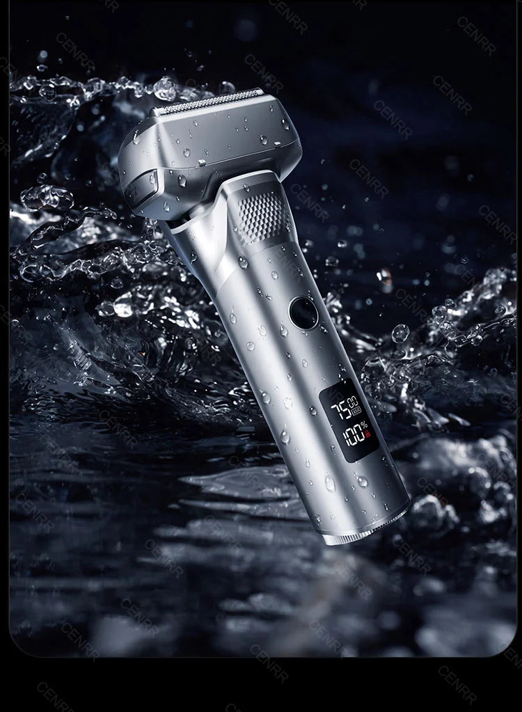 A silver portable electric shaver is shown dripping water in a dark, wet environment.