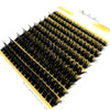 A fan-shaped cluster of black mink eyelashes displayed on a yellow background.