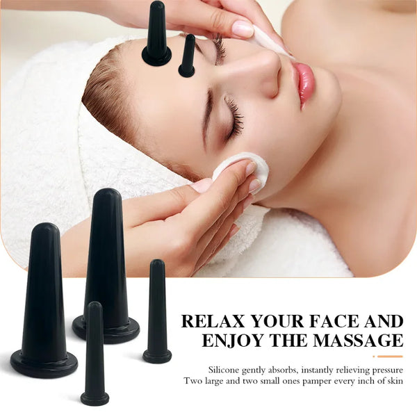 A woman is receiving facial cupping massage with silicone tools on her face.
