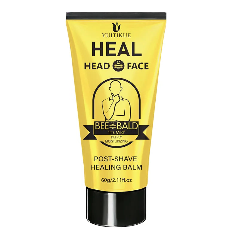 A yellow tube of YUITIKUE Heal Head Face Post-Shave Healing Balm for men