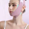 A woman is wearing a pink facial lifting strap designed to contour the face.