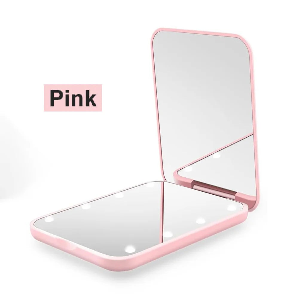 A pink portable LED magnifying makeup mirror shown in a closed and open view.