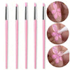 A set of pink silicone nail art brushes used for applying gel polish and creating designs on nails.