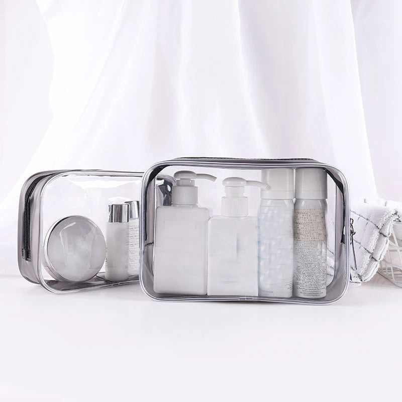 A clear waterproof travel cosmetic bag filled with various white and translucent liquid toiletries.