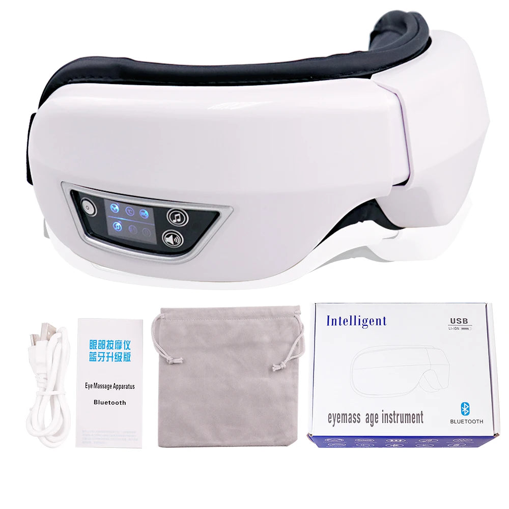 White portable Bluetooth eye massager device shown with accessories and packaging.