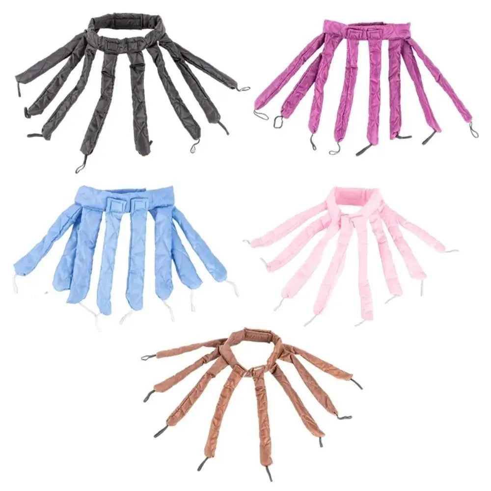 A collection of removable heatless hair curlers in black, purple, pink, and brown.