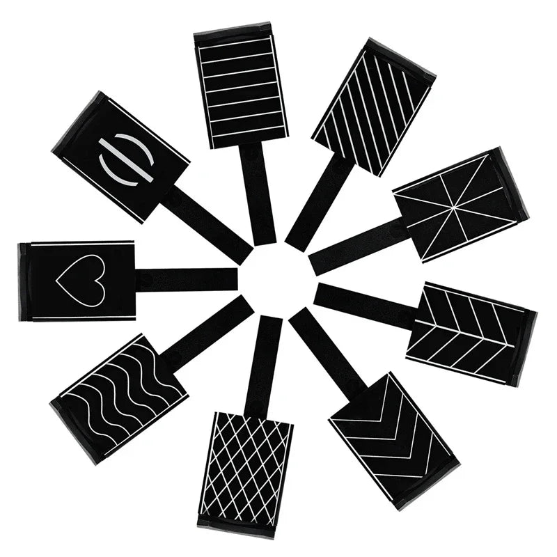 A set of six black cat eye nail magnet wands arranged radially.
