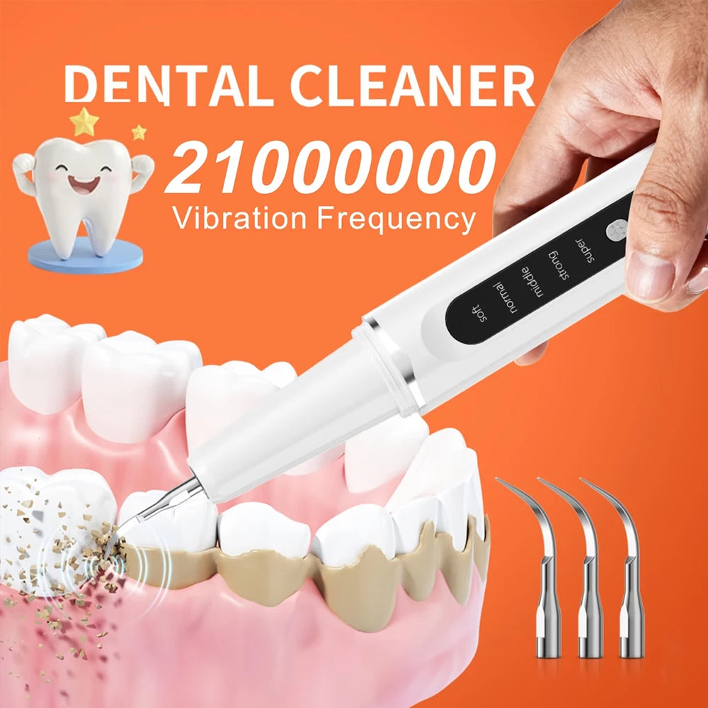 A hand holds a white electric dental cleaner device, demonstrating its vibration frequency, with teeth visible below.
