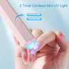 A hand holds a pink UV light device, demonstrating how to press once for 20 seconds or twice for 60 seconds on a fingernail.