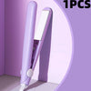 A purple mini portable flat iron hair straightener and curler shown against a light purple background.