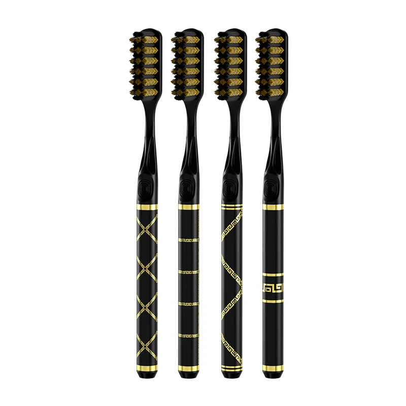 A set of four black toothbrushes with gold accents for daily oral care.