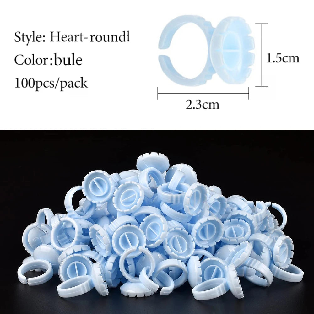 A pile of light blue disposable glue rings used for eyelash extensions and nail art