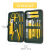 A set of 19 stainless steel beauty tools in a dark green case with yellow handles and blades.