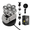 A silver electric shaver set featuring multiple attachments and a charging base.