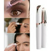 Close-up of a portable electric trimmer used for shaping eyebrows and facial hair on a woman's face.