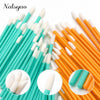 A set of disposable lip applicator brushes in various shades of white, light blue, and orange.