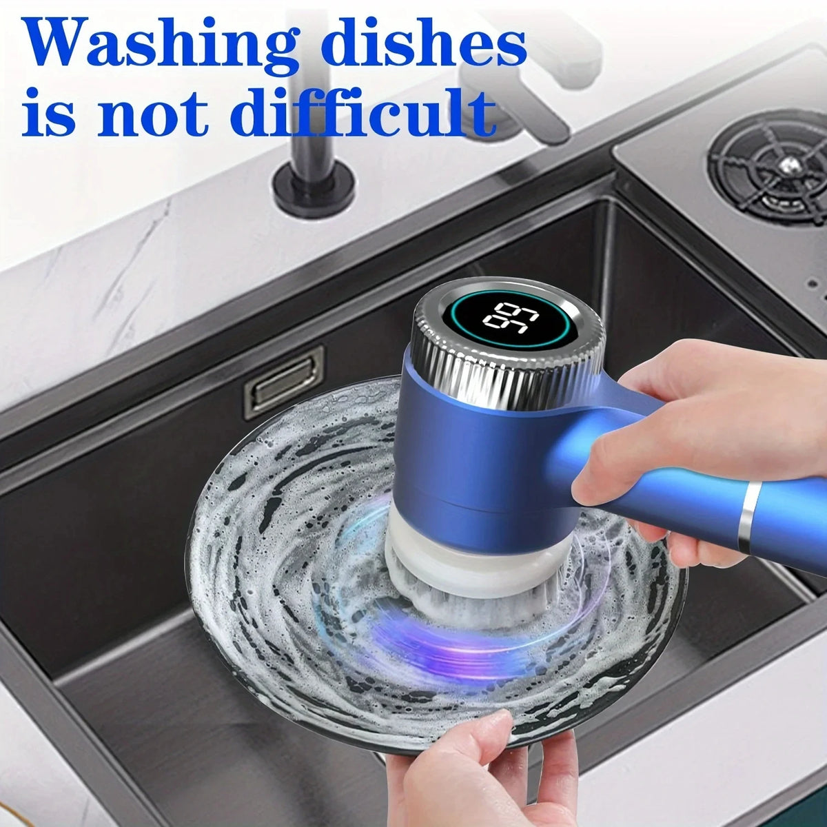A hand is using a blue electric spin scrubber with a brush head to clean dishes in a kitchen sink.