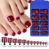 Un set de uñas postizas prensables en varios tonos de rojo y borgoña, mostrados en una mano y empaquetados en compartimentos 