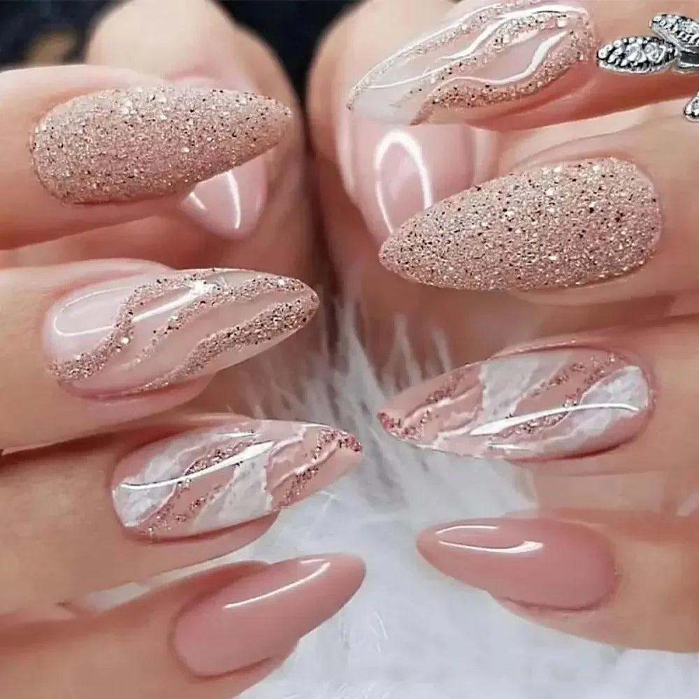 A close-up of a hand displaying press-on false nails with a pink and white French wavy design.