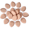 A collection of ten flesh-toned makeup sponge puffs arranged in a circular pattern.