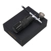 A black mini air compressor nail art spray tool is shown resting on its box.