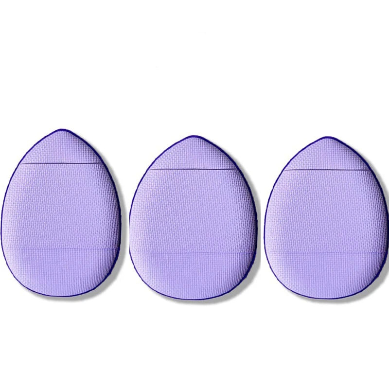 Three lavender mini finger puff foundation applicator tools shown side by side.