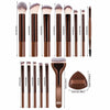 A collection of 17 professional makeup brushes and a round foundation applicator in a brown set.