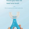 A hand holds a light blue silicone U-shaped toothbrush, demonstrating how to turn the brush to brush teeth.