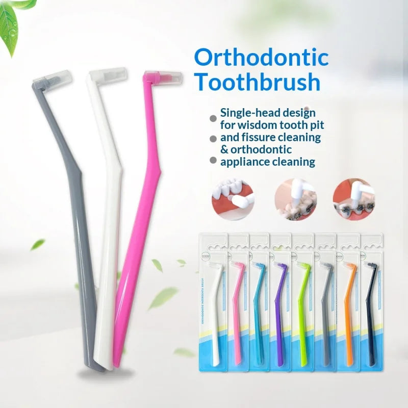 Collection de brosses orthodontiques à une tête dans diverses couleurs, y compris rose, blanc et multicolores.