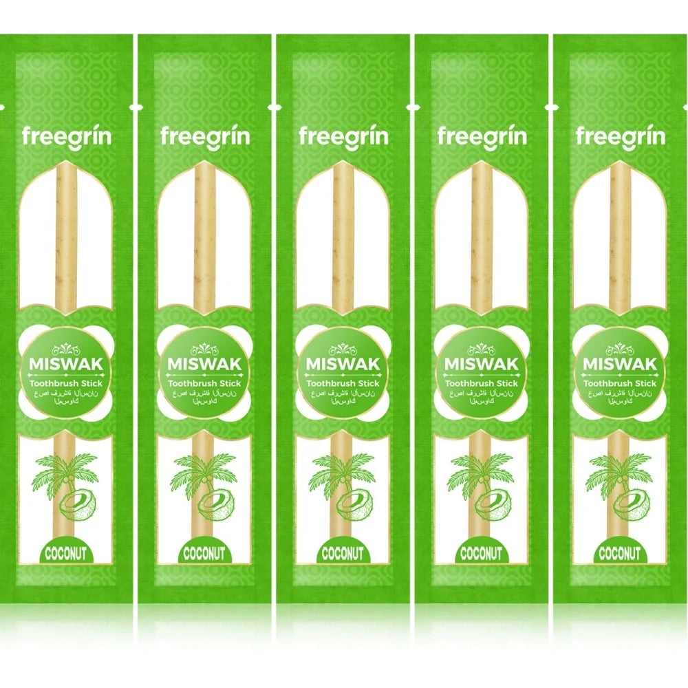 Five packs of freegrin Miswak toothbrush sticks with coconut leaves.