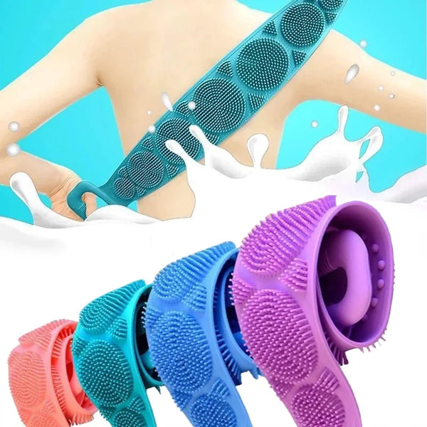 A hand is using a teal silicone body scrubber and massage brush on the back, with various colored brushes displayed below.