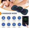 A hand is applying an electric muscle stimulator device to a person's shoulder during a massage session.